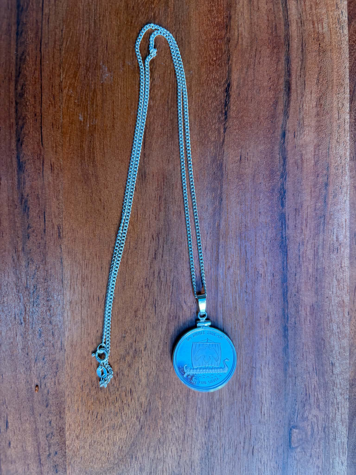 Reversible pendant necklace, Viking ship side
